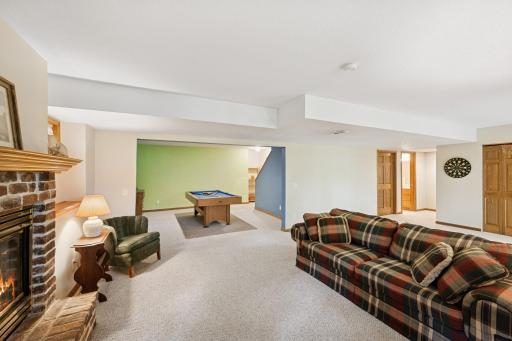 Lower level family room is pretty open. Bring your decor. How would you set this up?