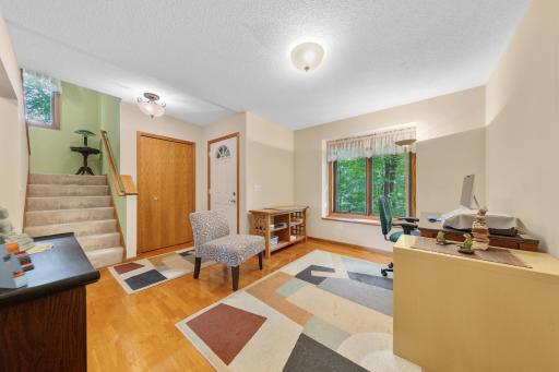 A versatile front flex space provides the ideal setup for a home office, study, or music nook.
