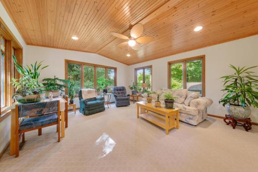 Thoughtful additions have expanded the home's living space to include a bright sunroom