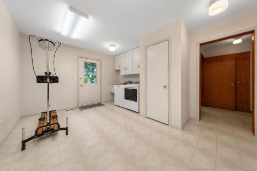 Thoughtful additions have expanded the home's living space to include a convenient main-level laundry room in the rear flex room