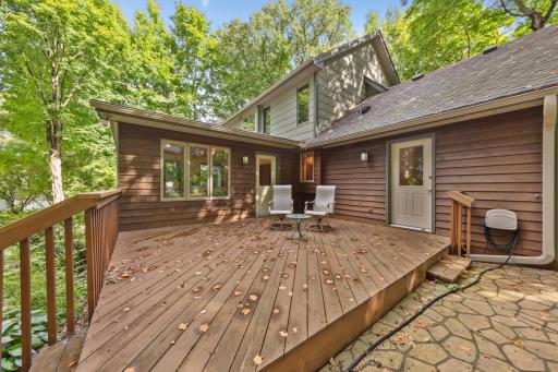 Step out onto the expansive back deck or lower patio to take in the moderate tree coverage
