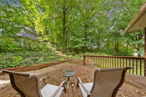 Step out onto the expansive back deck or lower patio to take in the moderate tree coverage