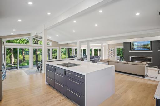 Impressive kitchen island with quartz waterfall and storage galore