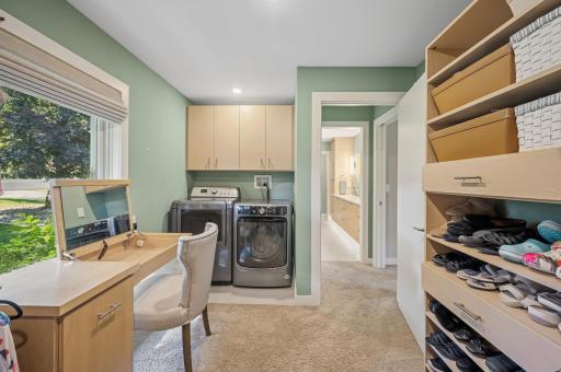 Dedicated laundry within the master closet.