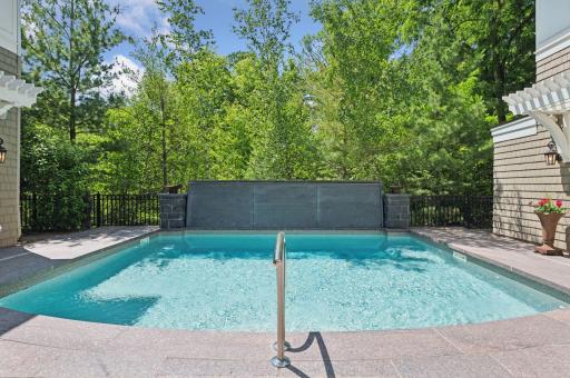 Serene wooded views and waterfall feature.