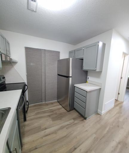 All appliances are stainless steel. Laundry, water heater, and furnace are all located in the kitchen. Stacked washer/dryer combo.
