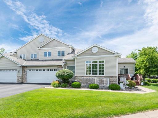 Amazing curb appeal with an oversized driveway for additional guest parking, spacious green space & neatly maintained landscaping.
