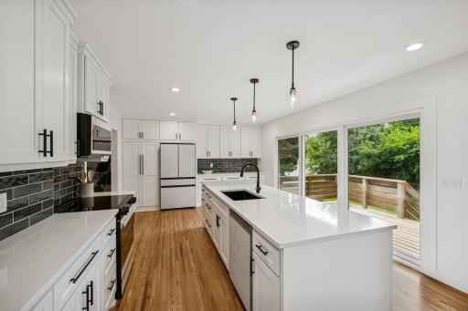 Gourmet kitchen with huge 10ft island and walkout to deck.jpg