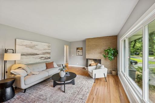 Main floor living room with wood burning fireplace .jpg