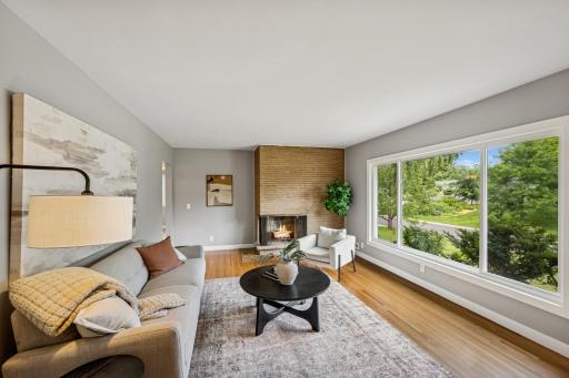 Main floor living room with wood burning fireplace.jpg