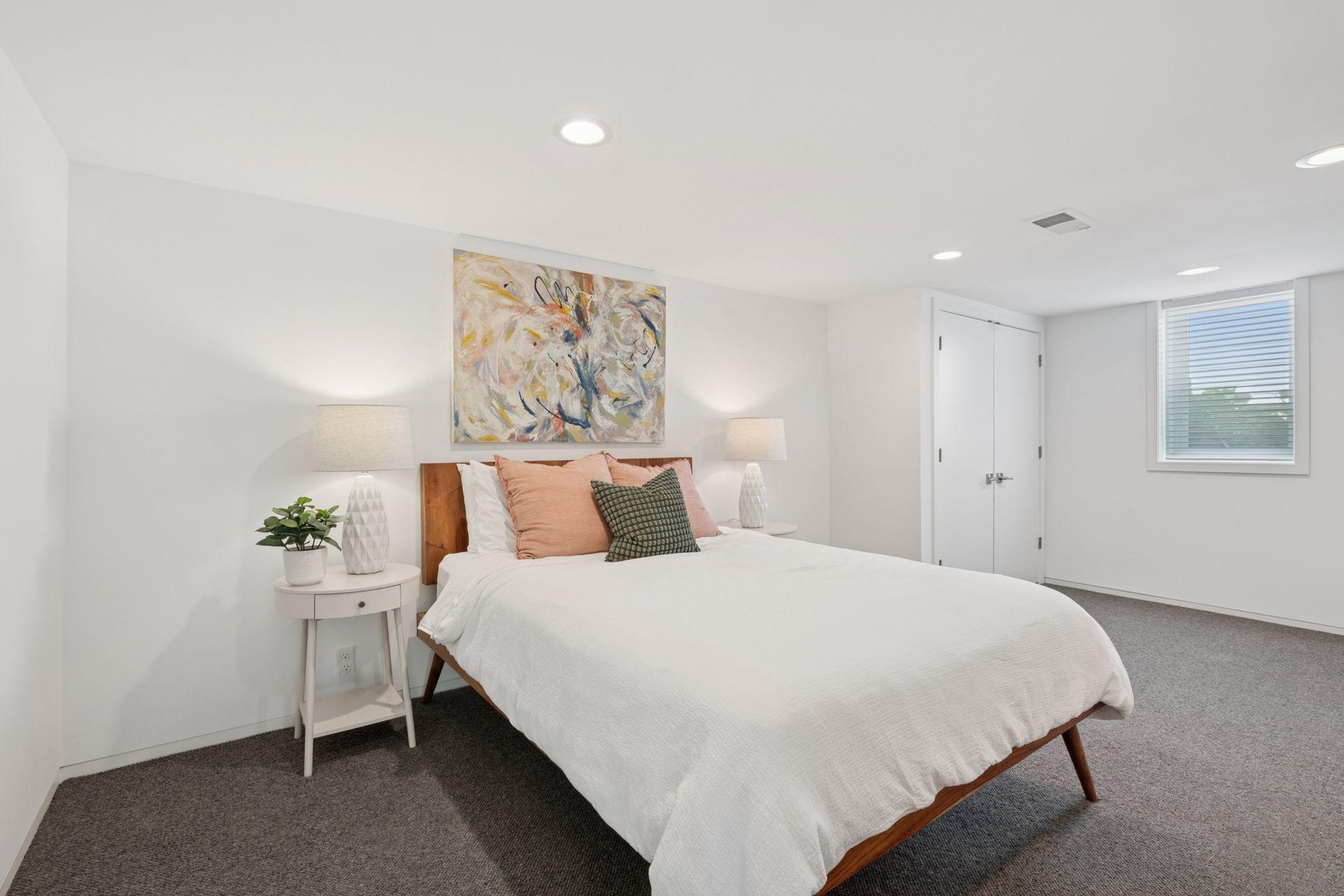 Lower level en-suite bedroom with 3 closets!