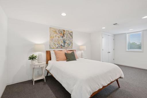 Lower level en-suite bedroom with 3 closets!