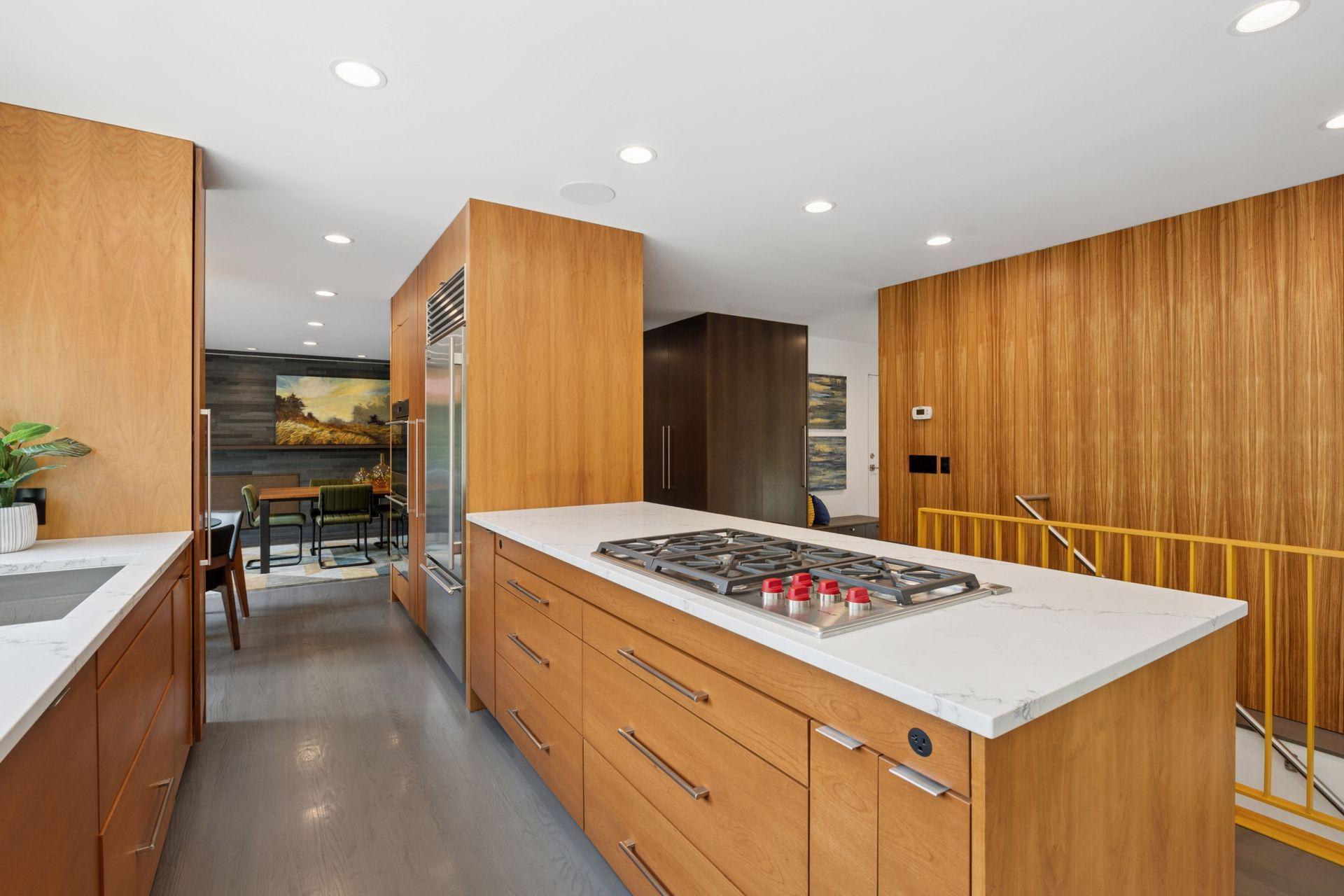 Updated custom cabinetry, new quartz countertops and new Wolf Cooktop