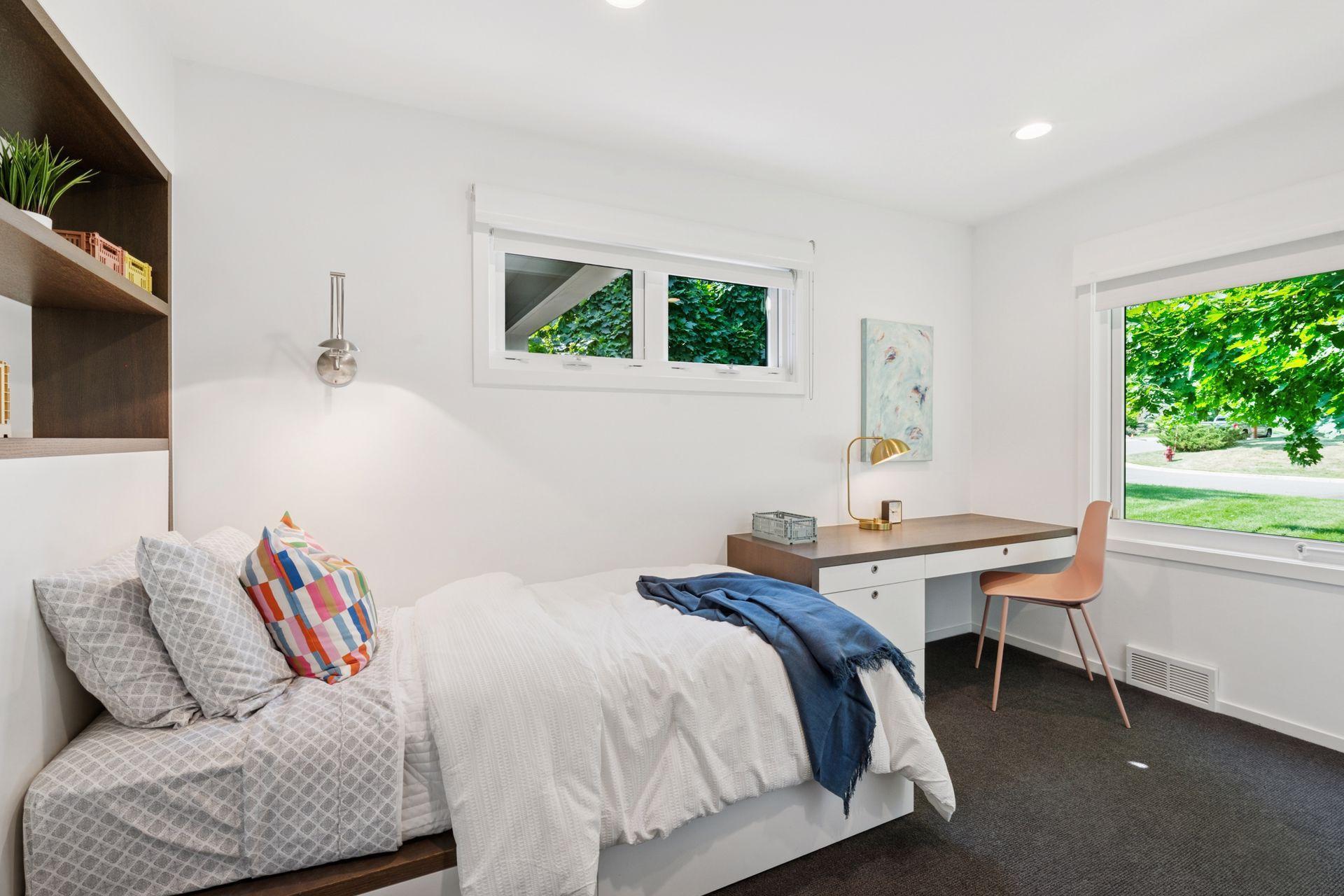 Second of two guest/kids bedrooms with custom built-in cabinetry