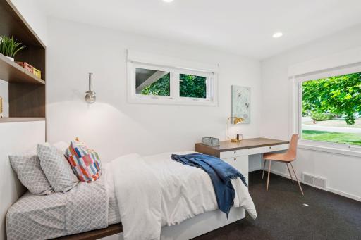 Second of two guest/kids bedrooms with custom built-in cabinetry