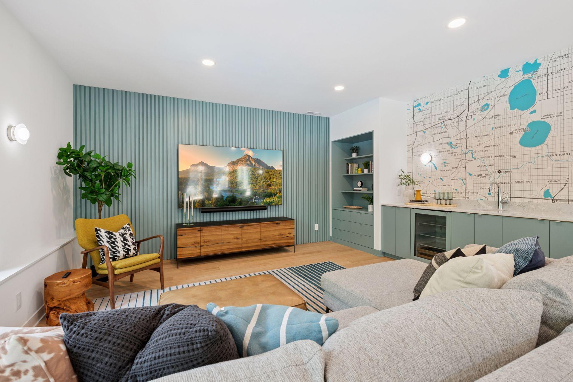 New lower level family room with custom slat wall, storage / display cabinet, full wet bar with beverage fridge, custom wallpaper