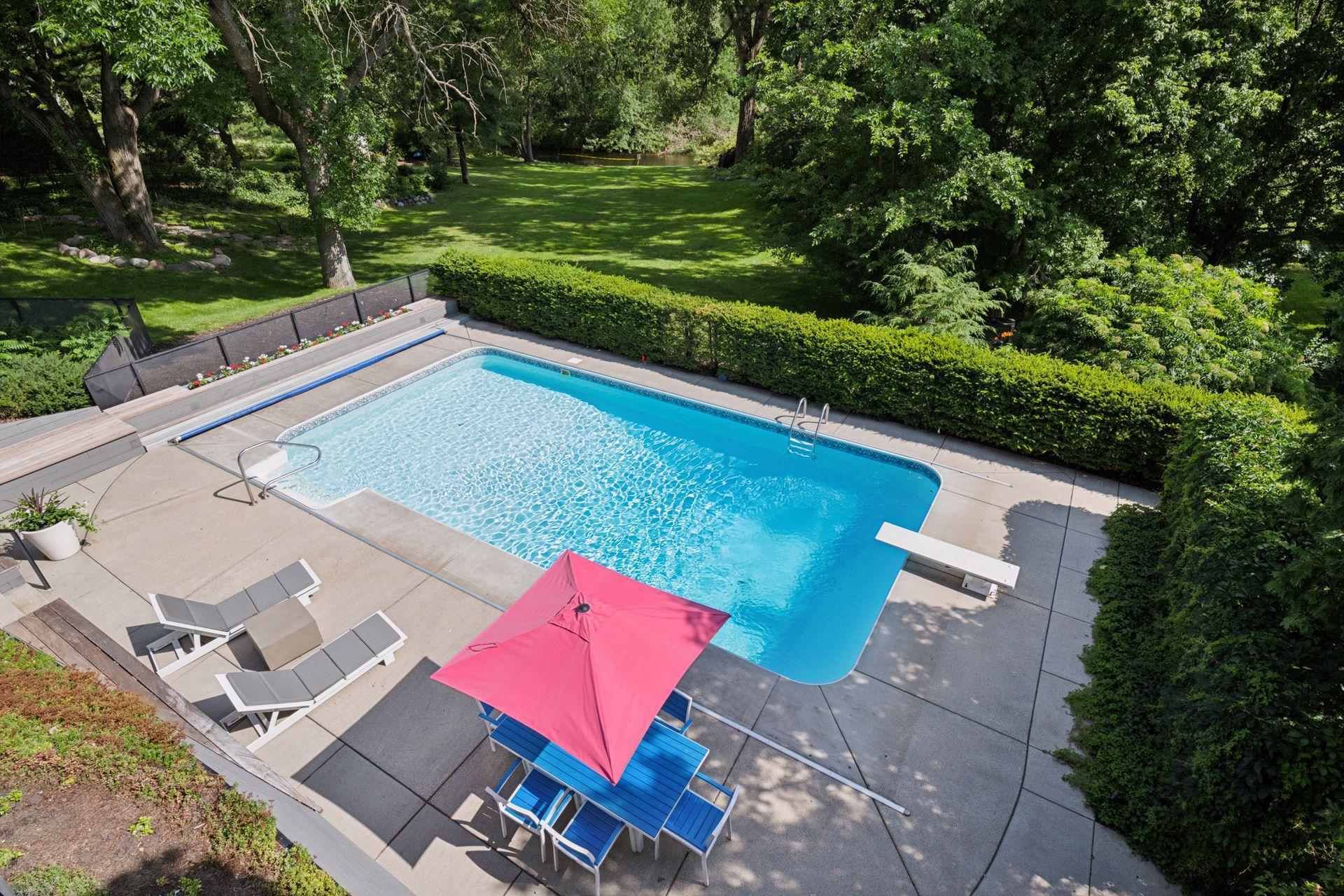 View from main level deck down to pool area and creek