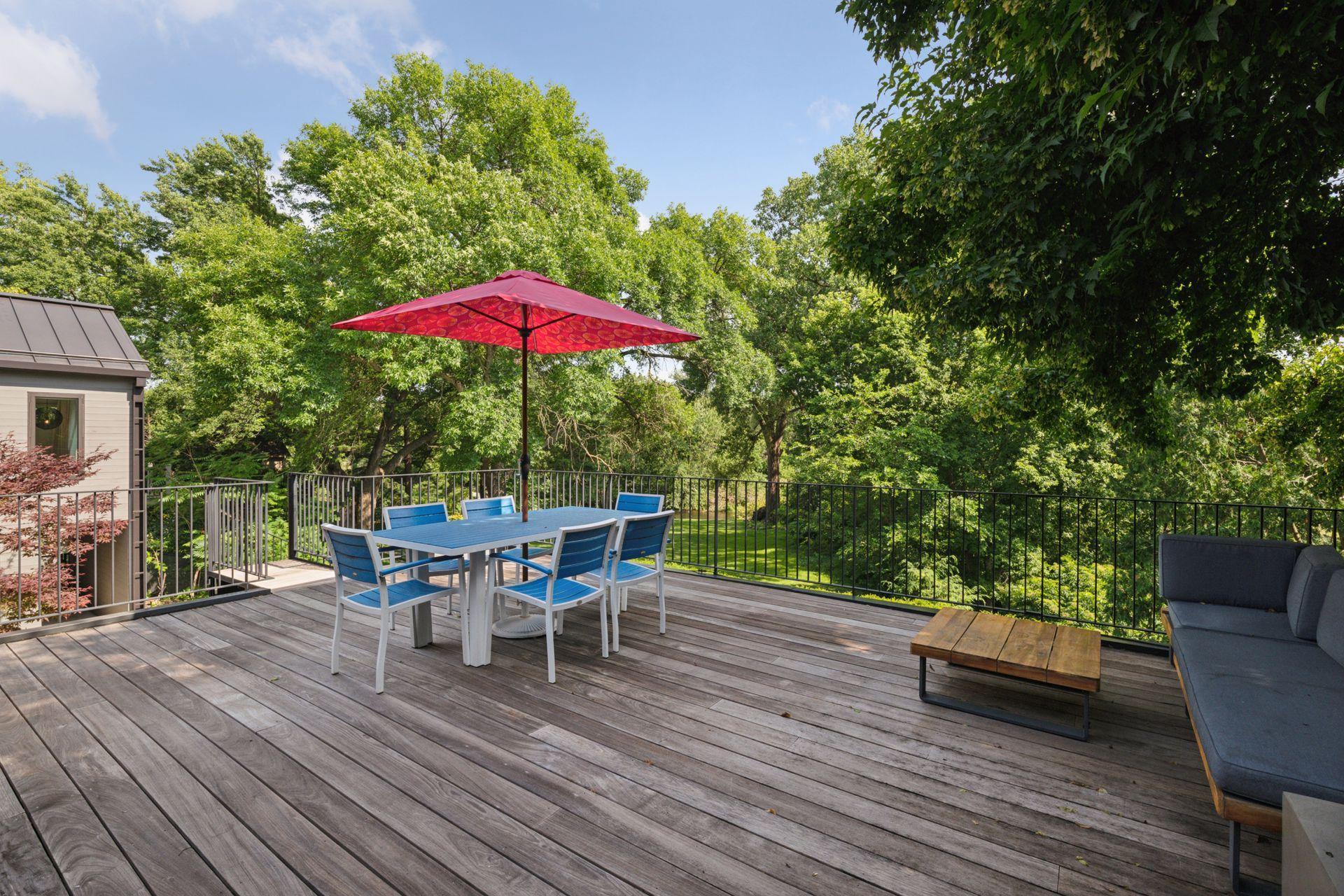 Main level deck with ironwood decking and spiral staircase to lower level patio