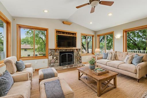 4-season porch with gas fireplace (virtually staged)