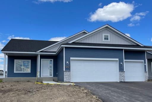 9752 32nd St NE - Home will be ready for move-in 8/25/25! One level home features a spacious concrete front porch located on a walkout homesite. Sod, Irrigation System, and Front Plantings included.