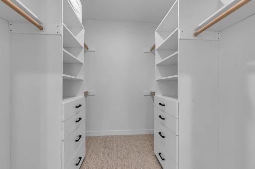 The walk-in closet does not disappoint in this private luxe suite