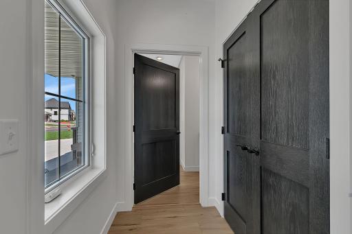 The front entry with huge closet is complemented great natural light and leads to a spacious main floor guest bath