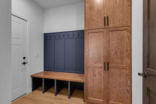 The main floor mudroom off the garage is fantastic drop spot & offers tons of storage