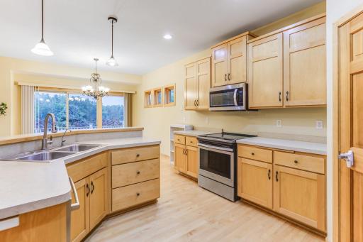 Enjoy abundant counter space and ample cabinetry, which provide both functionality and ample storage.