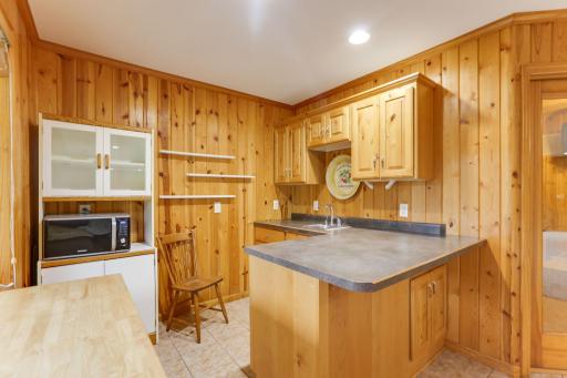 Wet bar includes a refrigerator and microwaveâideal for entertaining, snacks, and convenient lower-level living.
