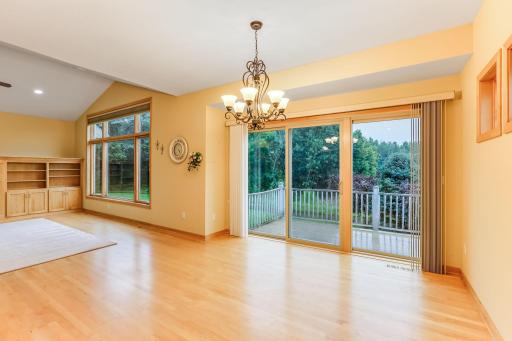 A sliding glass door and large window fill the space with beautiful natural light, creating a bright and airy atmosphere.