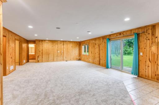 Lower-level family room boasts a spacious open layout, perfect for all your entertaining needs and gatherings.