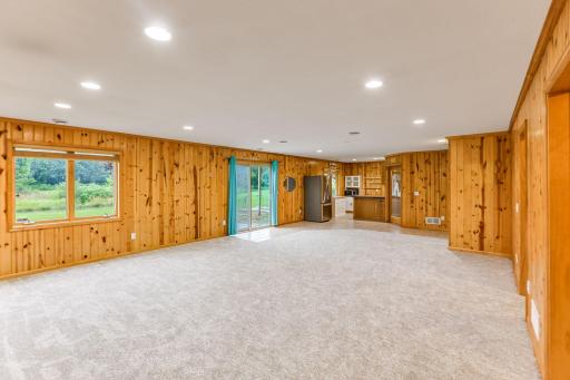 The spacious family room walks out to the backyard, offering easy access to outdoor living and entertaining.