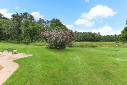 Beautiful backyard with scenic golf course views, mature landscaping, and plenty of space to relax or entertain.