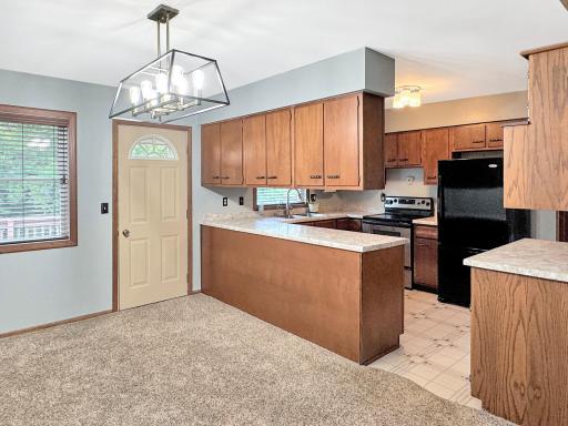 Dining area with door that leads to backyard deck