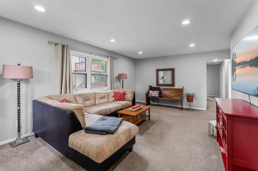 Living room with windows on two walls - lots of natural light.