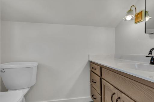 Upper level half bath is a great addition to the home offering is a thoughtfully designed space.