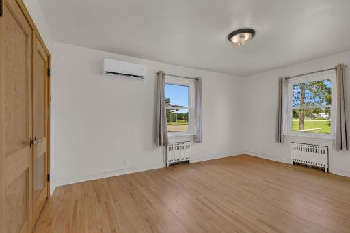 First of 3 main level bedrooms with refinished hardwood floors, large closet & ample space.