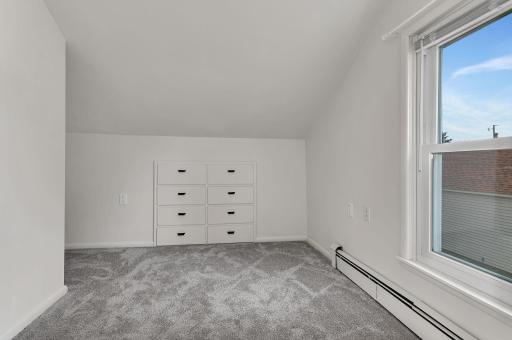 Upper level sitting area would make a great office space or play area. This area has fresh paint & new carpet. Move in and enjoy all this home has to offer.
