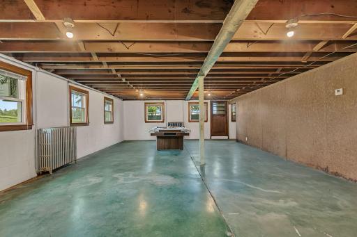 Large unfinished area with large windows & walk out to the backyard. There is so much that could be done with this space. Bring your ideas, start imagining how to make this yours!