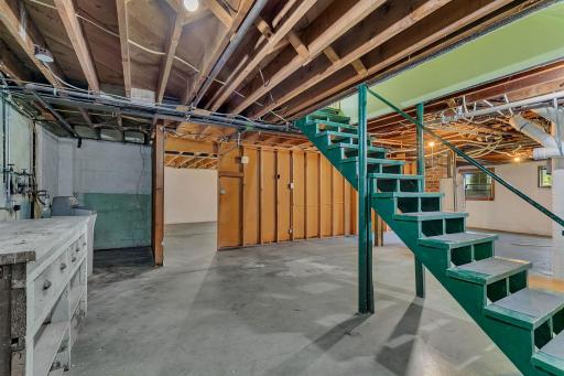 Lower level unfinished basement has ample space. This portion is partially used for utilities. Bring your imagination. This space could be awesome!