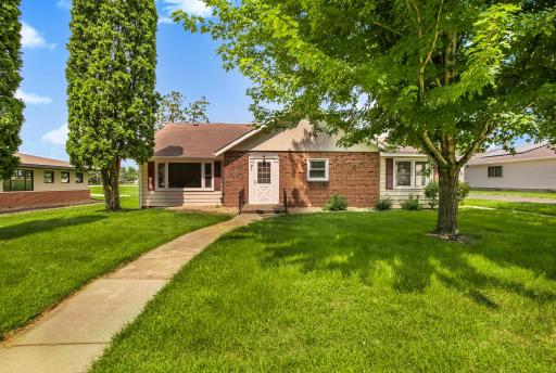 Charming 1940s exterior showcases classic architectural details and timeless curb appeal. From the gently sloped roofline to the siding and trim, this home exudes vintage character.