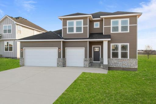 The Erie home, complete with a 3 car garage, is the most sought after floorplan in our community. This picture is of a previous model.