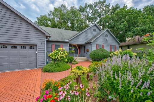 This beautifully finished one-level-living home has spectacular gardens and a private and woodsy back yard adjacent to the Lake McKusick walking trail.