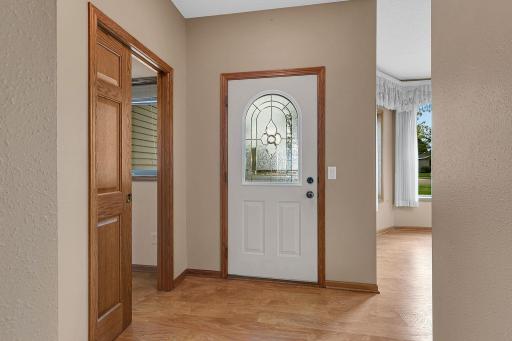 Entryway with access to the laundry room.