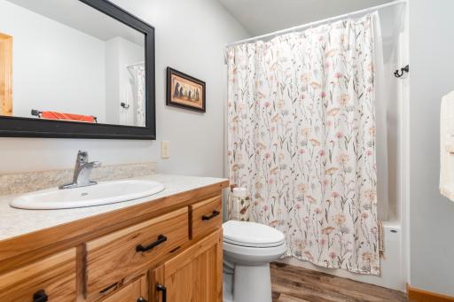 The main floor full bath is conveniently located near each bedroom and all other living spaces making it ideal for guests and everyday use.