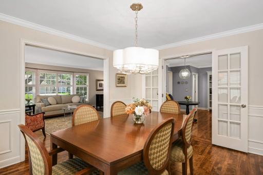Wainscoting and crown molding; French doors to expand the opening and improve flow to the kitchen