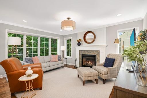 Main floor family room with new windows, gas fireplace and mantel