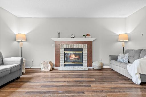 Cozy gas fireplace can be enjoyed from the family room and kitchen. Perfect for those cooler nights that are just around the corner!