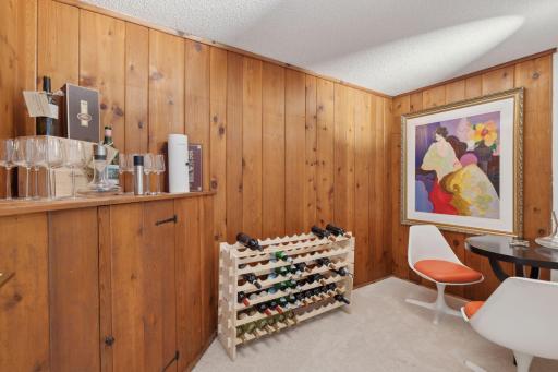 A wine room off the wet bar. The lower level also has a sauna and exercise room.