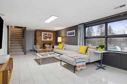 Walkout lower level with heated Terrazzo floors. The lower level also has a sauna and exercise room.